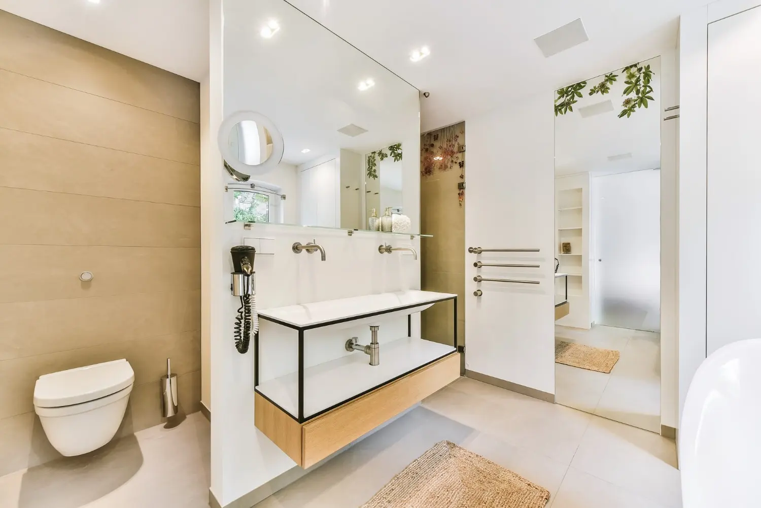 Completed bathroom remodel with floating vanity and wall-mounted toilet