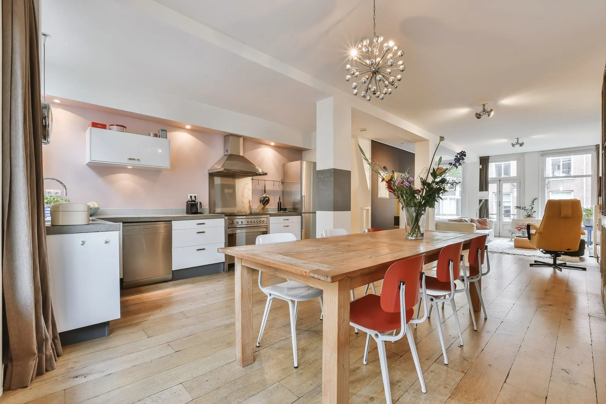 Completed open kitchen remodel with wood dining table