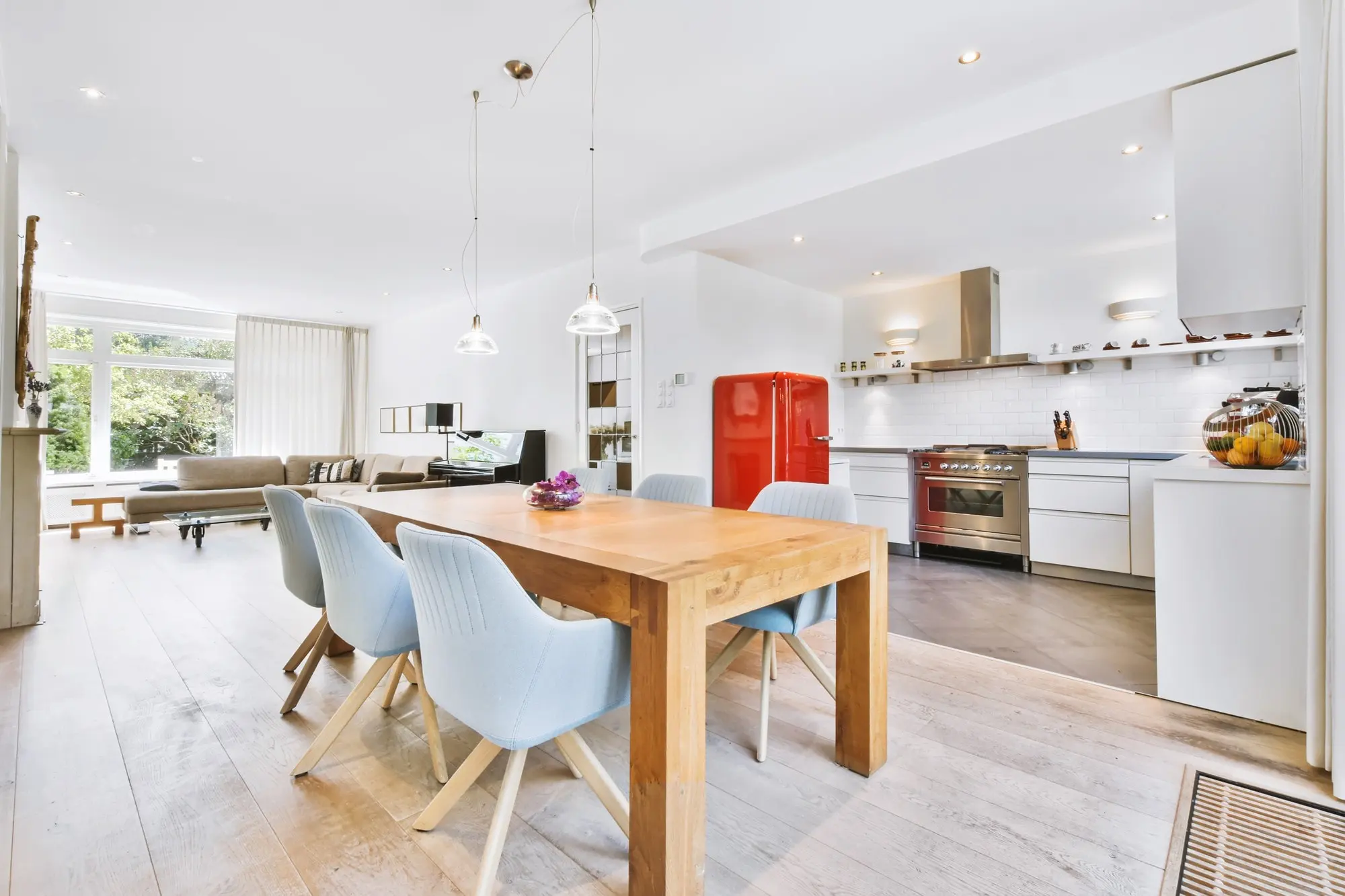 Completed white open-plan kitchen remodel with dining area