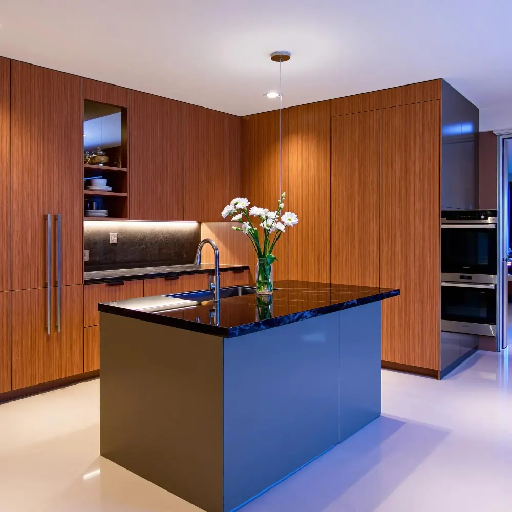 Completed kitchen remodel with wood cabinets and a modern island